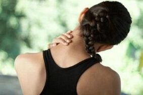 Girl is worried about symptoms of cervical vertebrae